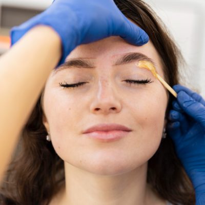 woman-getting-eyebrow-treatment